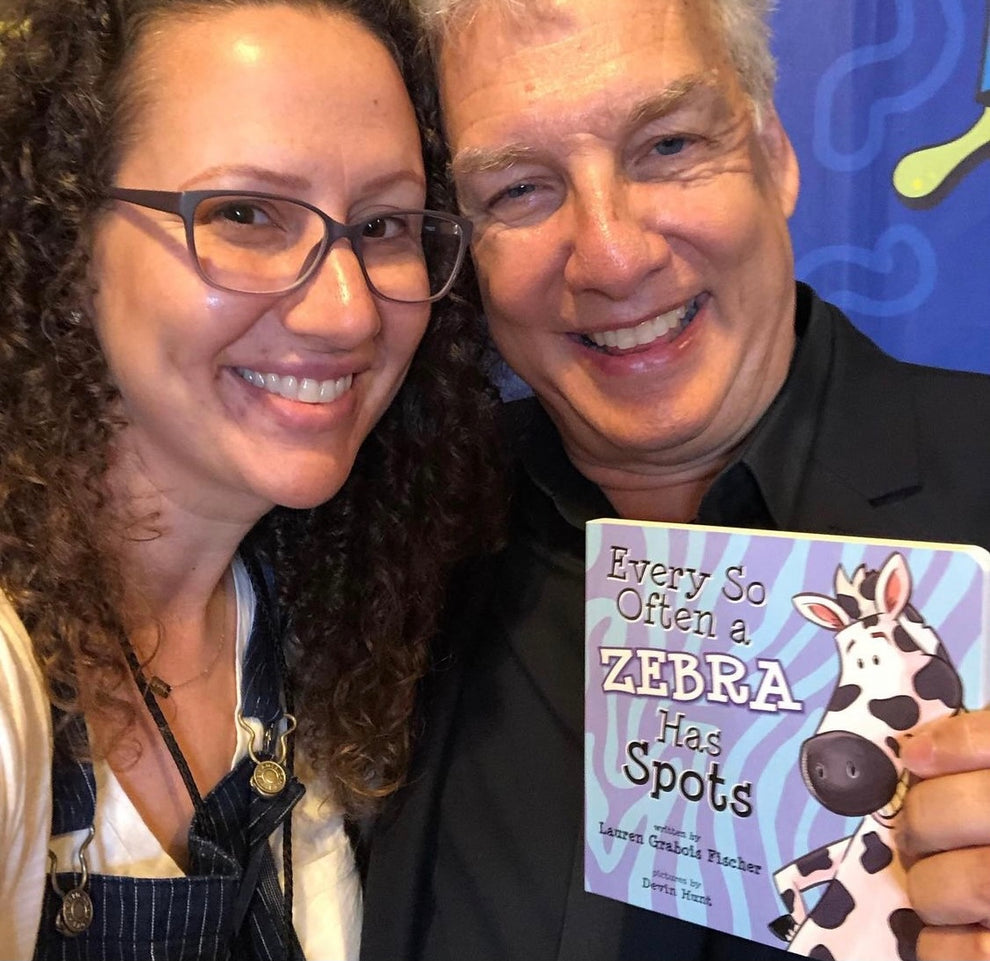 Lauren Grabois Fischer with TV Personality, Comedian, Game Show Host, Producer and Talk Show Host on Nickelodeon Marc Summers, proudly holding her book 'Every So Often a Zebra Has Spots'