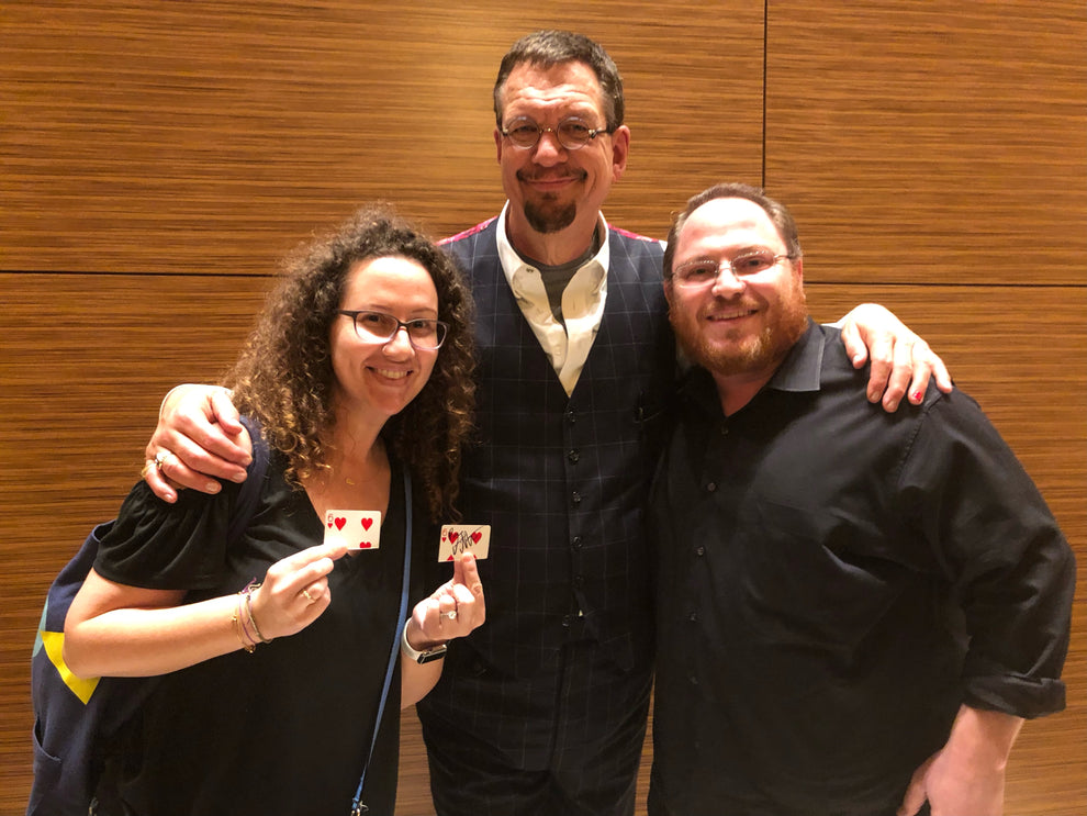 Lauren Grabois Fischer with of Penn Fraser Jillette, of Penn and Teller holding her books 'Love Grows Love' and 'You Are a Superhero'